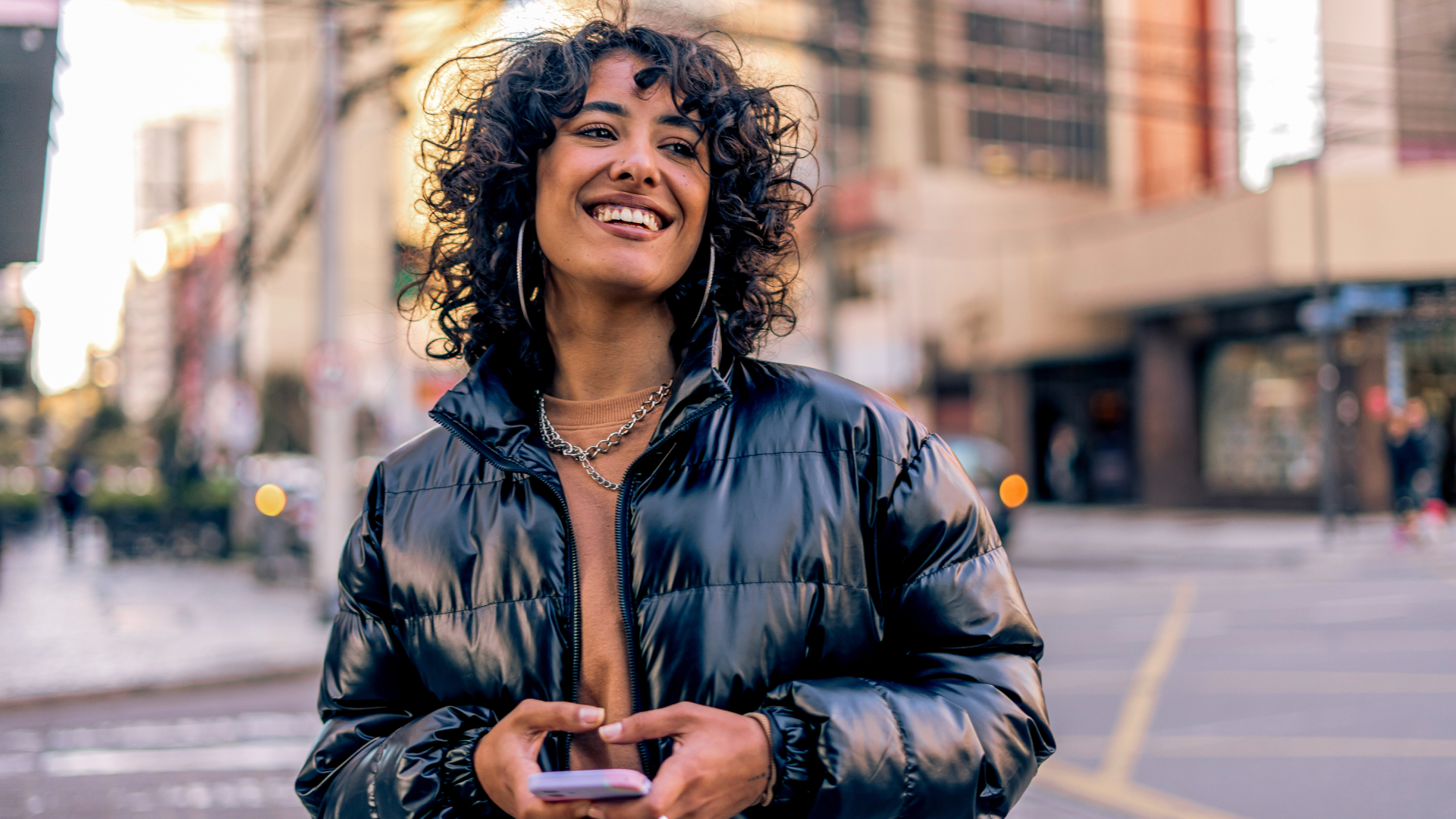 An image of a woman holding her phone.
